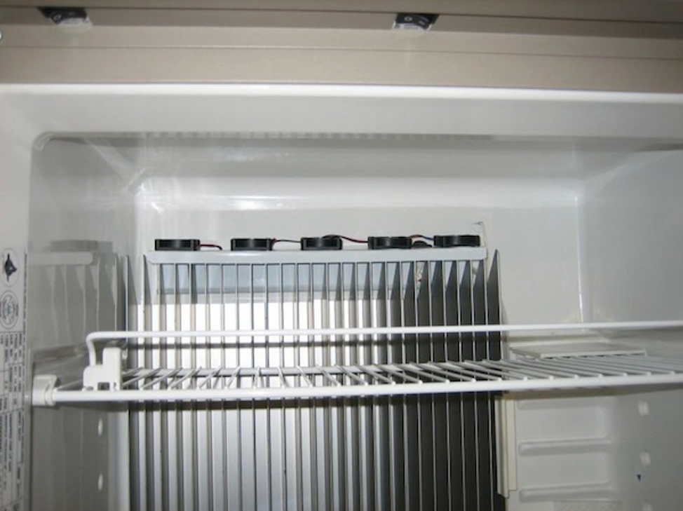 A picture containing indoor, cabinet, appliance, white goods

Description automatically generated