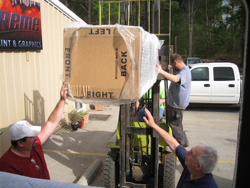 A person standing in front of a truck

Description automatically generated